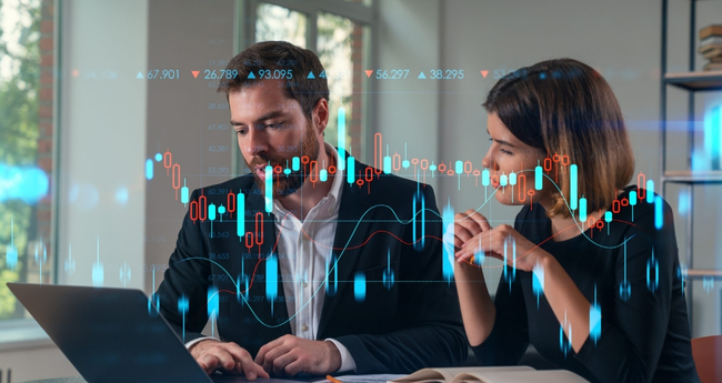 Business professionals looking at data visualizations and analytics