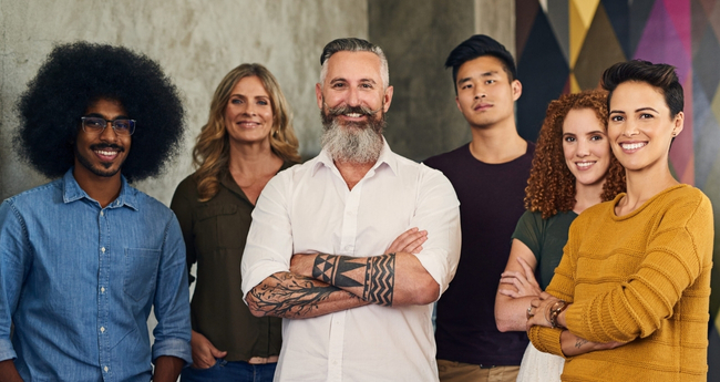 A diverse group of professionals posing for team photo