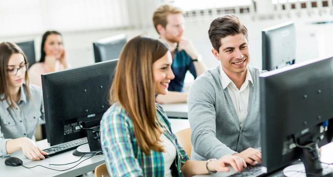 Group of professionals collaborating in a modern workspace, showing Eccera’s team-driven tech culture