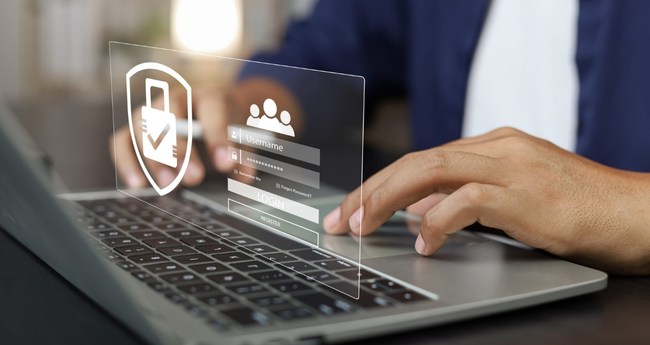Hands typing on laptop with digital overlay showing secure login screen